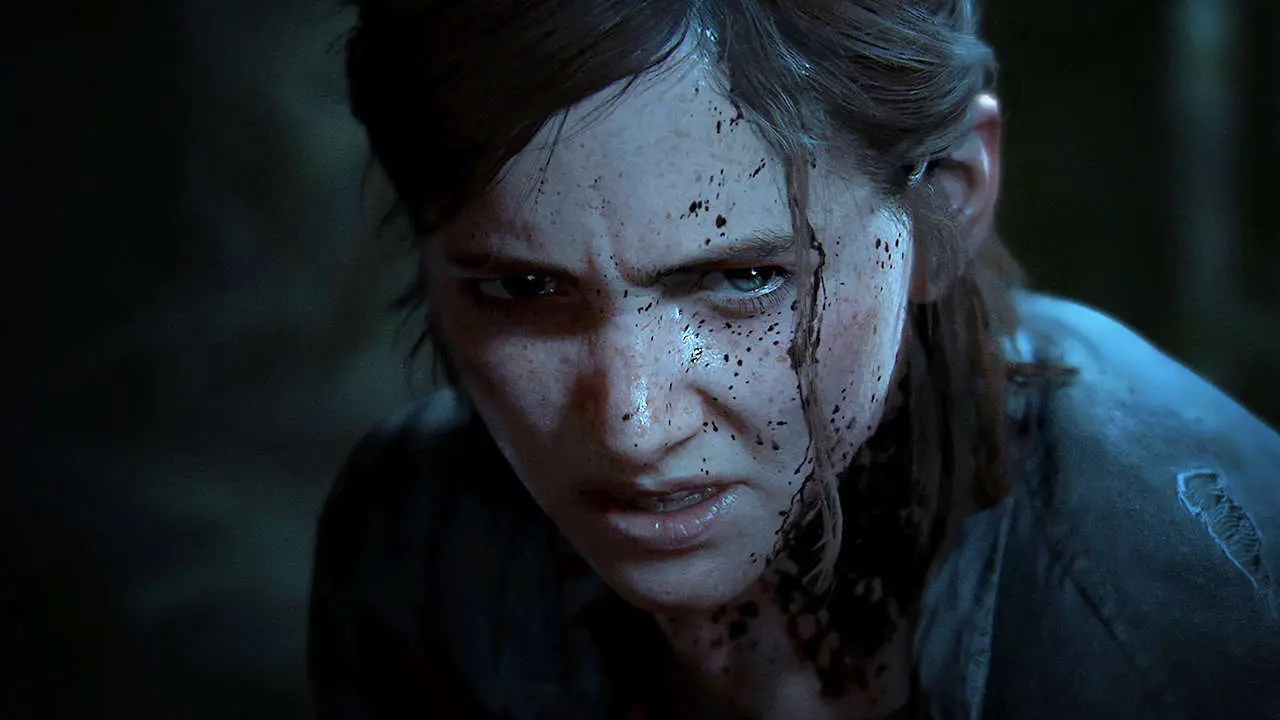 The Last of Us 2 para PS5 - Ellie com a expressão fechada e cheia de ódio no olhar com um pouco de sangue pingado no lado esquerdo do rosto.