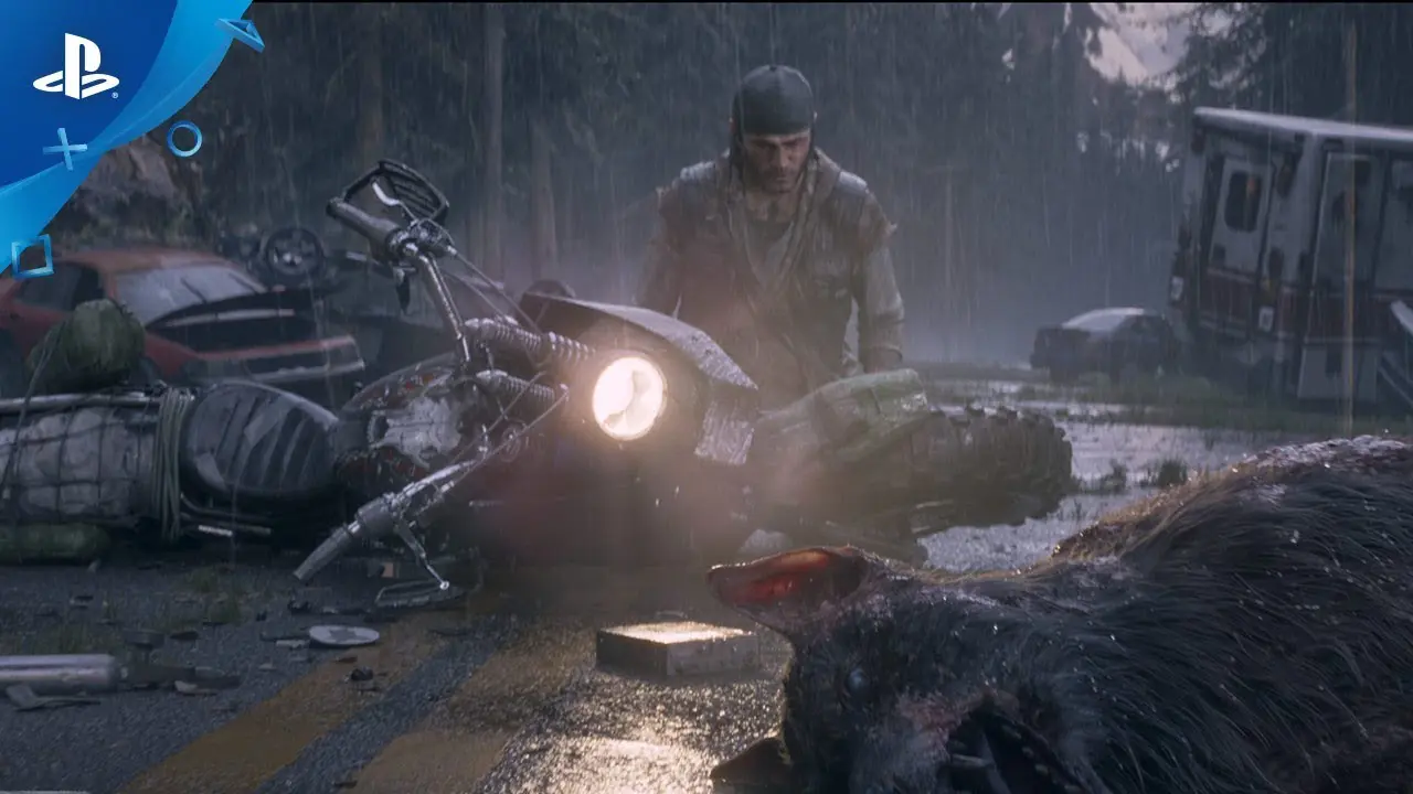 Deacon, protagonista de Days Gone, da Bend Studio, de joelhos em uma estrada chuvosa com uma moto tombada e lobos mortos.