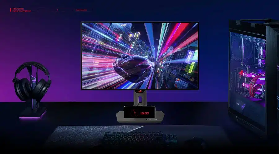 Imagem de divulgação mostra novo monitor da Asus em uma mesa com outros periféricos e um celular.